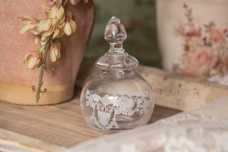Glass perfume bottle in a romantic style