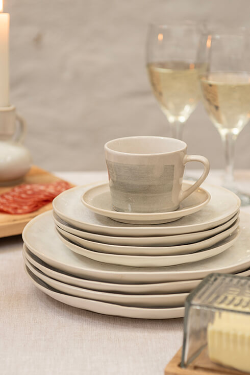 Wine glasses, plates, and a teacup