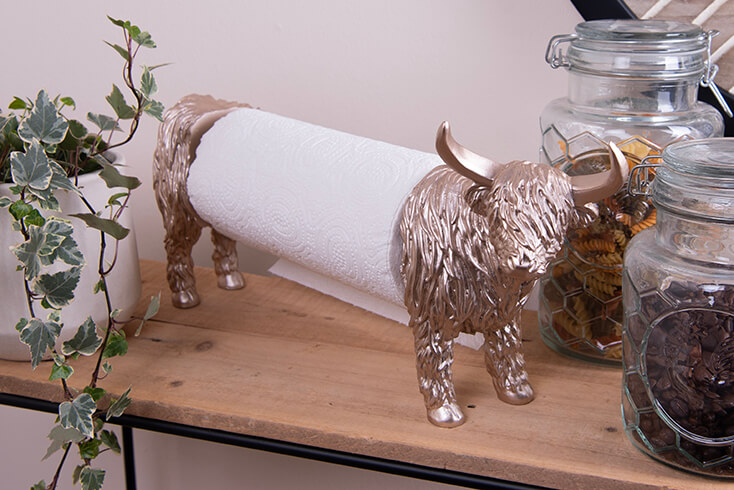 A silver buffalo kitchen roll holder