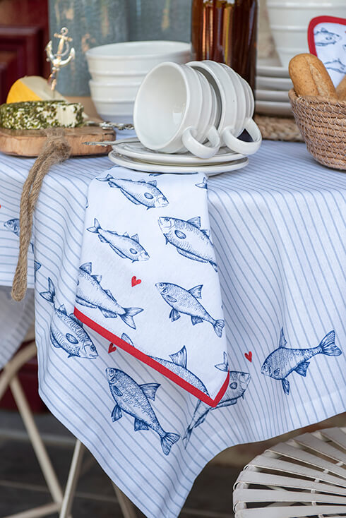A fish-themed kitchen towel with blue and red colors