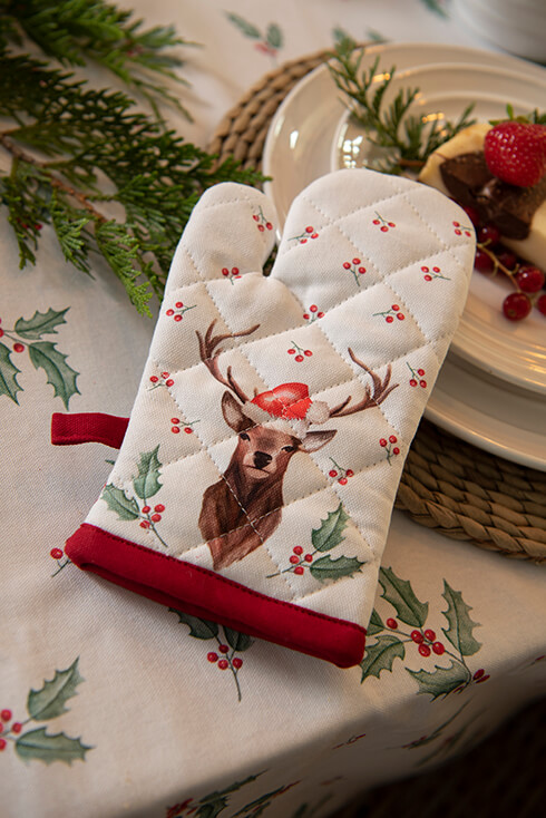 A children's oven mitt with a reindeer wearing a Christmas hat and holly around it