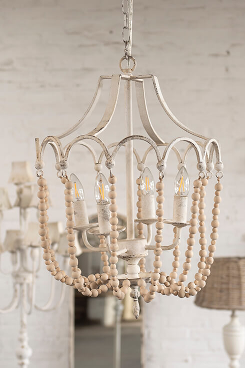 A rural pendant light with metal finishing and wooden beads