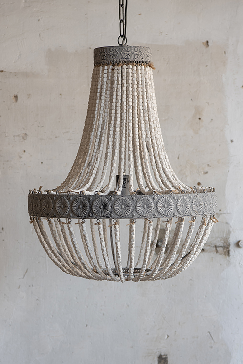 A shabby chic chandelier made of wooden beads
