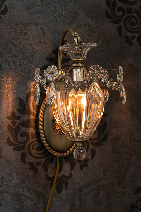 A crystal chandelier wall lamp