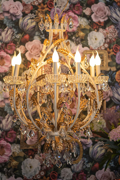 A dramatic chandelier with candle lighting
