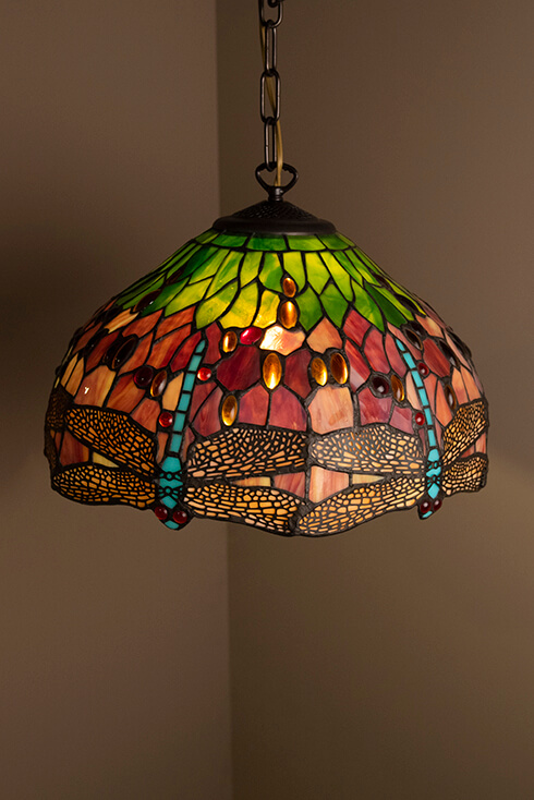 Tiffany lampshade as a pendant light with the classic dragonfly
