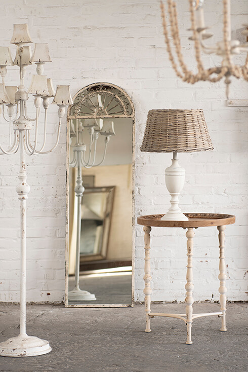 A shabby chic style with a rustic table lamp and side table, and a shabby floor lamp with a large dressing mirror