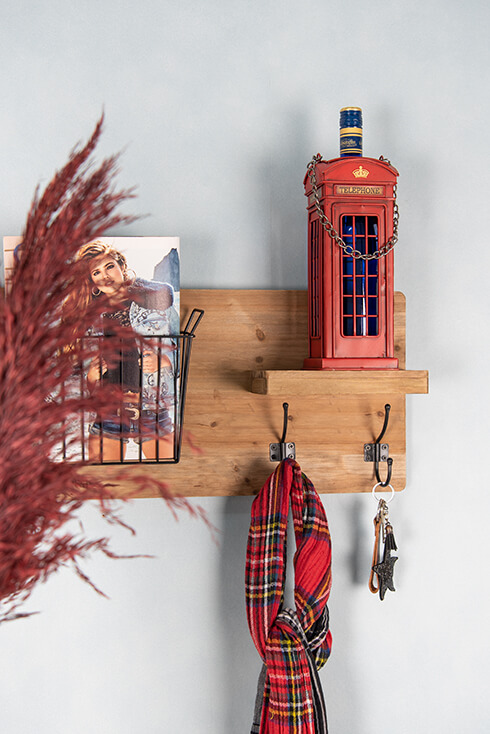 A red telephone booth as a bottle rack