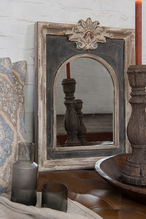A table mirror with candle holders